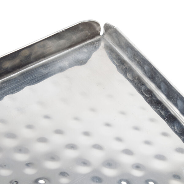 An American Metalcraft stainless steel hammered tray with holes in it.