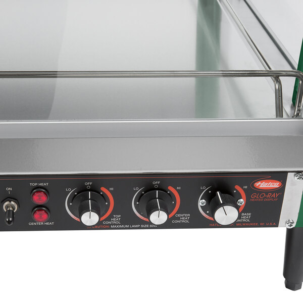 A Hatco stainless steel countertop hot food display warmer with dual shelves.