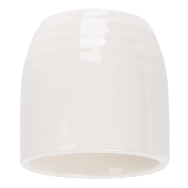 A white ceramic cup with a curved rim.