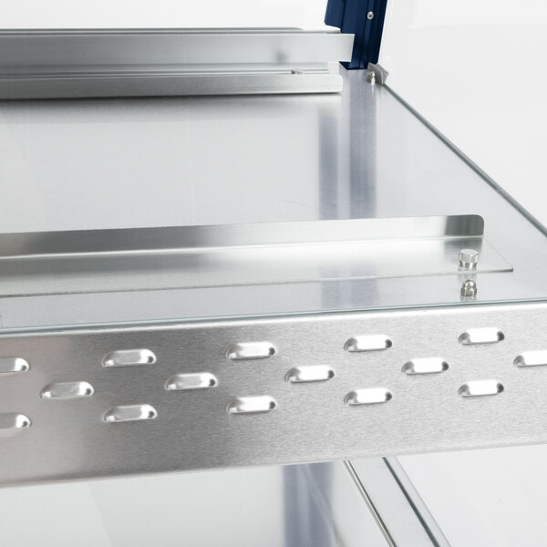 A metal Hatco countertop shelf with metal trays on top.