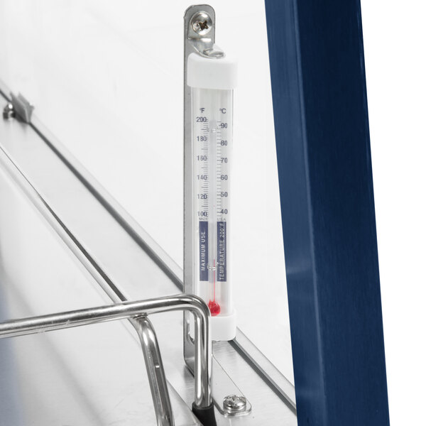 A Hatco stainless steel countertop food warmer with a thermometer on a metal shelf.