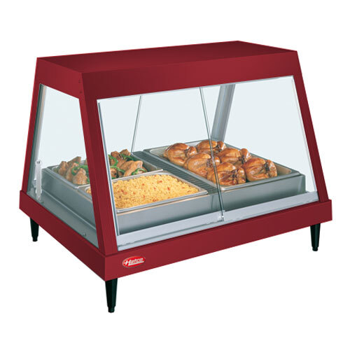 A Hatco stainless steel countertop display case with cooked chicken on a red tray.
