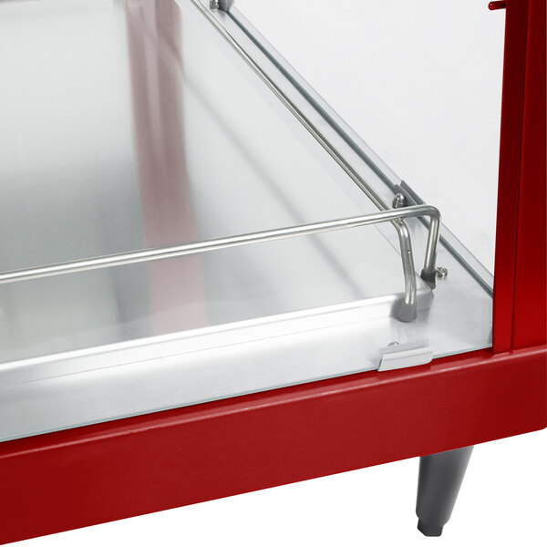 A red and stainless steel Hatco countertop food warmer with dual shelves and a glass door.