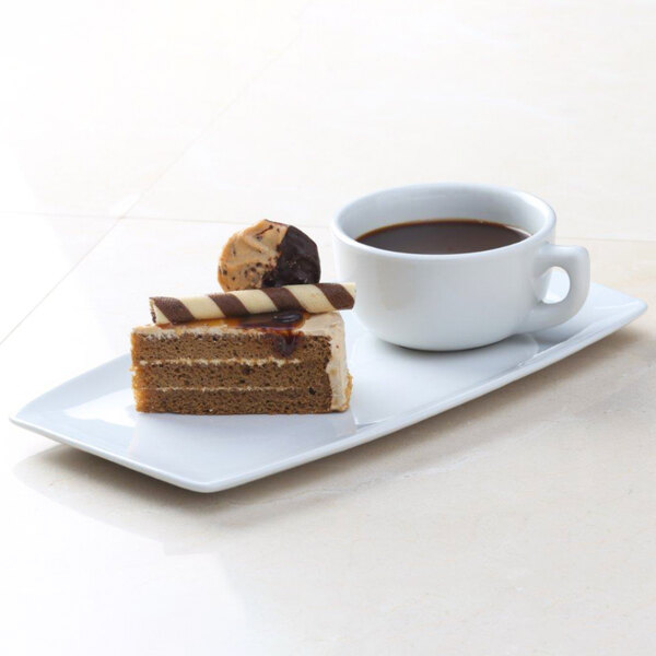 A Tuxton white china tray with dessert and a cup of coffee.
