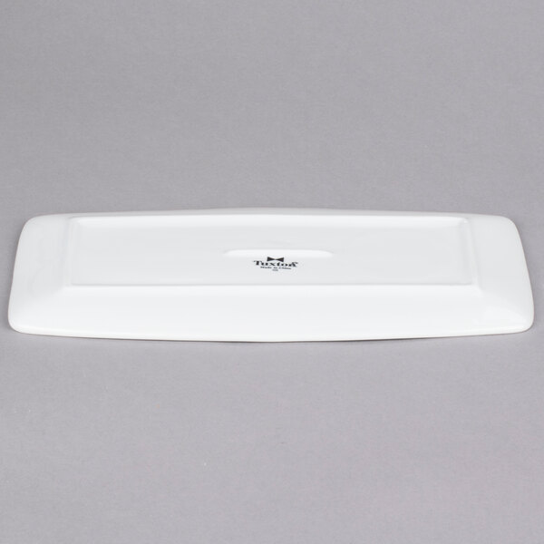 A white rectangular Tuxton china tray with tapered ends.