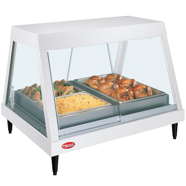 A white Hatco countertop display case with food on a tray.