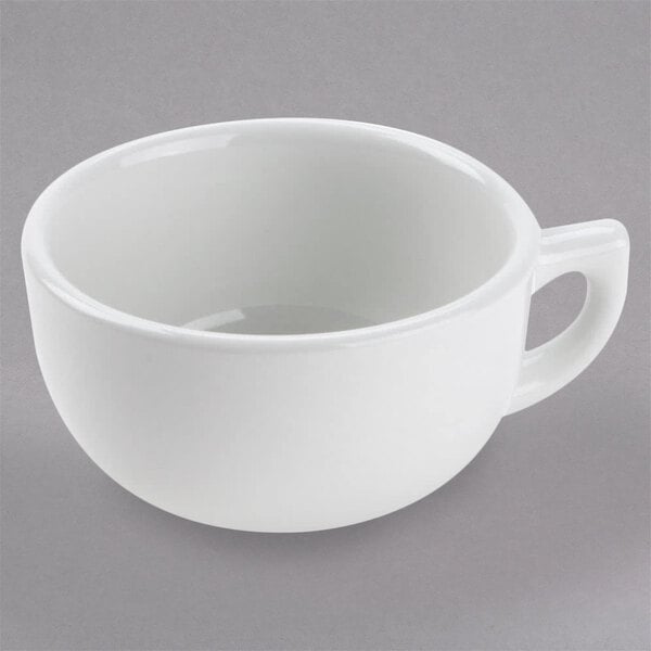 A Tuxton bright white china cappuccino cup with a handle.