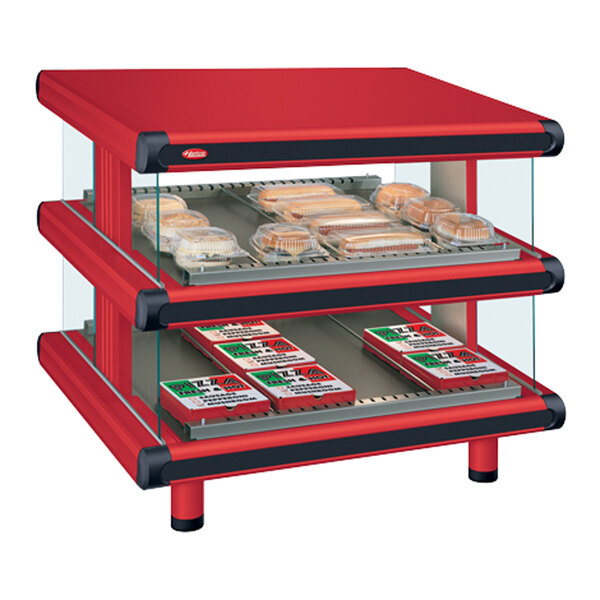 A red and black Hatco food display case with two shelves and trays of hot food.