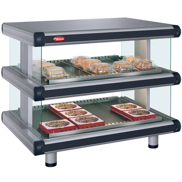 A Hatco countertop hot food display case with food trays inside.