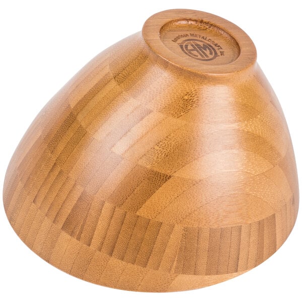 An American Metalcraft bamboo bowl with a circular design on it.