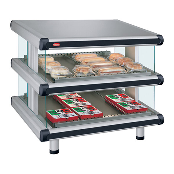 A Hatco White Granite Glo-Ray double shelf countertop food display case with food trays inside.