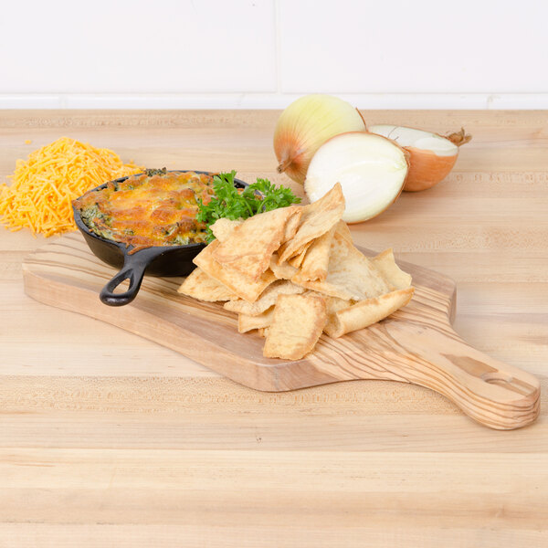 An American Metalcraft olive wood serving board with a bowl of dip, chips, and onions.