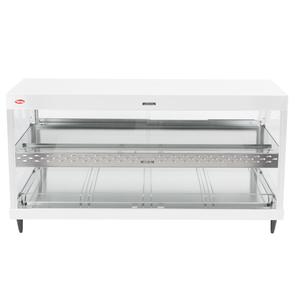 A white rectangular Hatco countertop merchandiser with glass shelves.