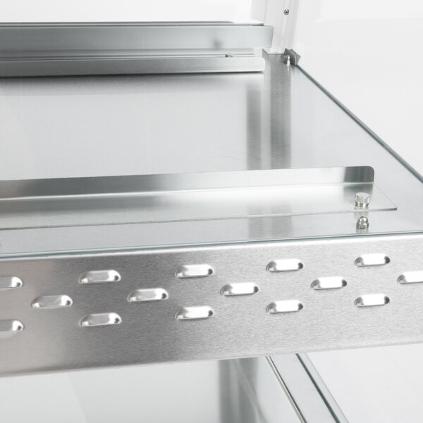 A white granite stainless steel Hatco countertop dual shelf warmer with metal shelves.