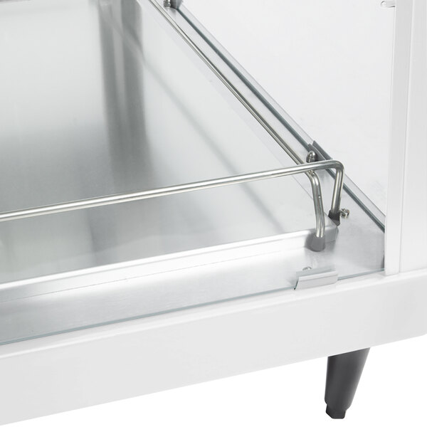 A Hatco stainless steel countertop display shelf with metal handles.
