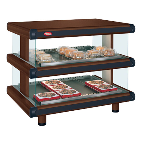 A Hatco countertop display case with trays of food inside.