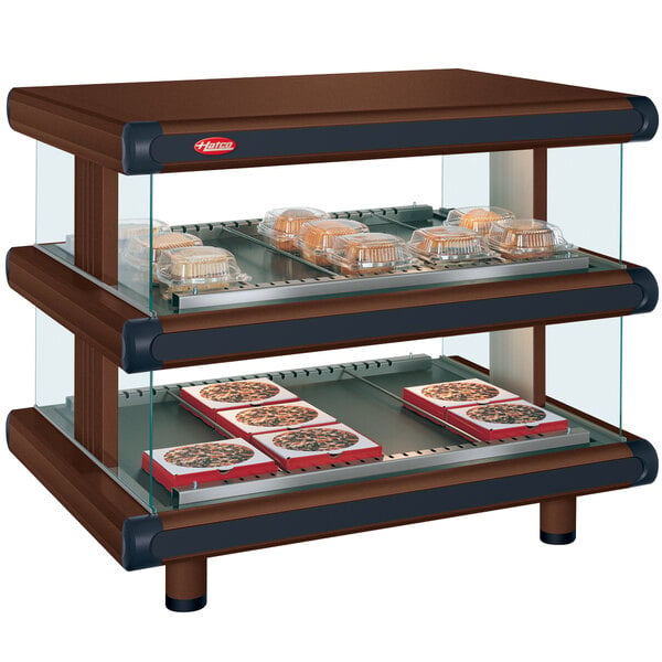 A Hatco countertop display case with food trays in it.