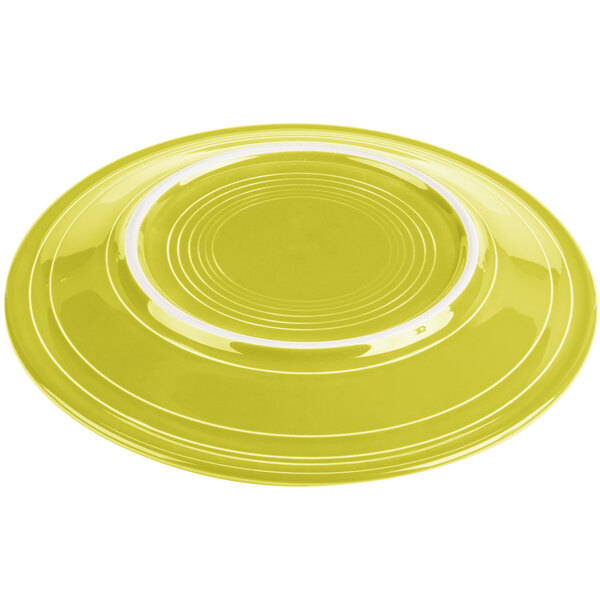 A Fiesta® Lemongrass china dinner plate with a white rim.