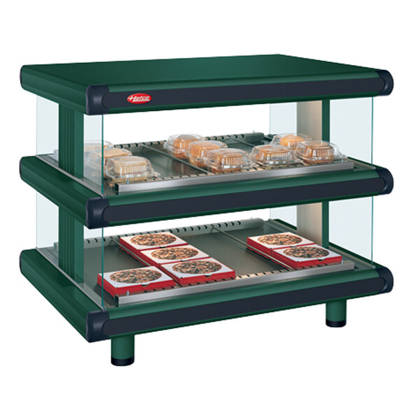A Hunter Green Hatco countertop food warmer display case with food on it.
