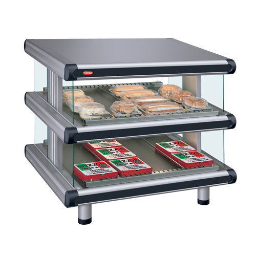 A Hatco slanted double shelf countertop food warmer display with food trays inside.