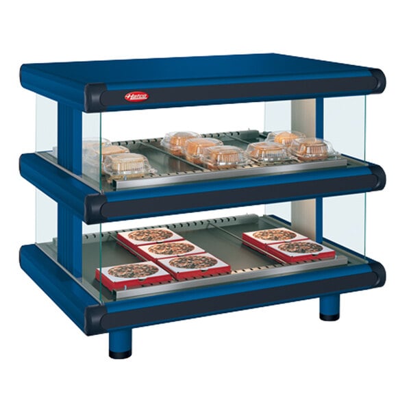 A navy blue Hatco countertop display case with two shelves and trays of food.