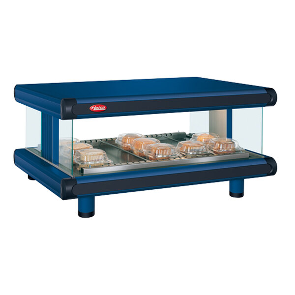 A navy blue Hatco countertop food warmer with clear trays of food.