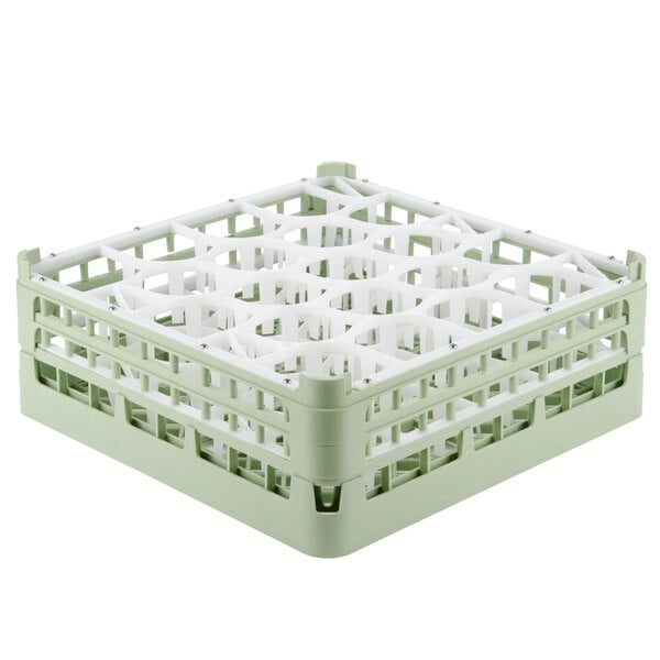 A light green Vollrath plastic glass rack with 20 small compartments.