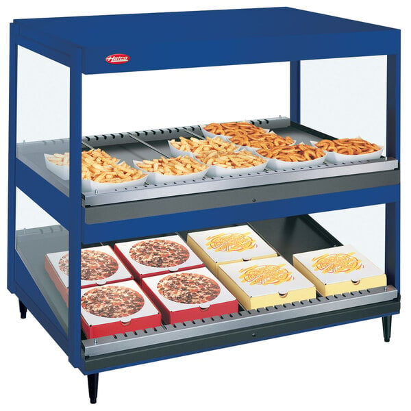 A navy blue Hatco countertop food display warmer with trays of food.