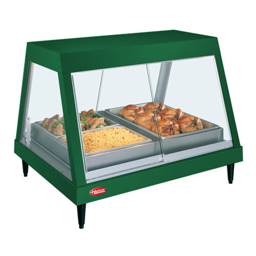 A Hatco Hunter Green stainless steel countertop food warmer with cooked chicken on a shelf.