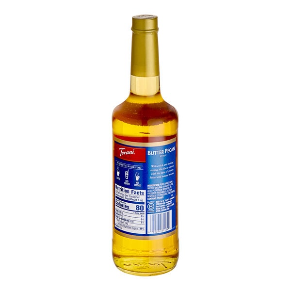 A close up of a Torani Butter Pecan flavoring syrup bottle with a blue label.