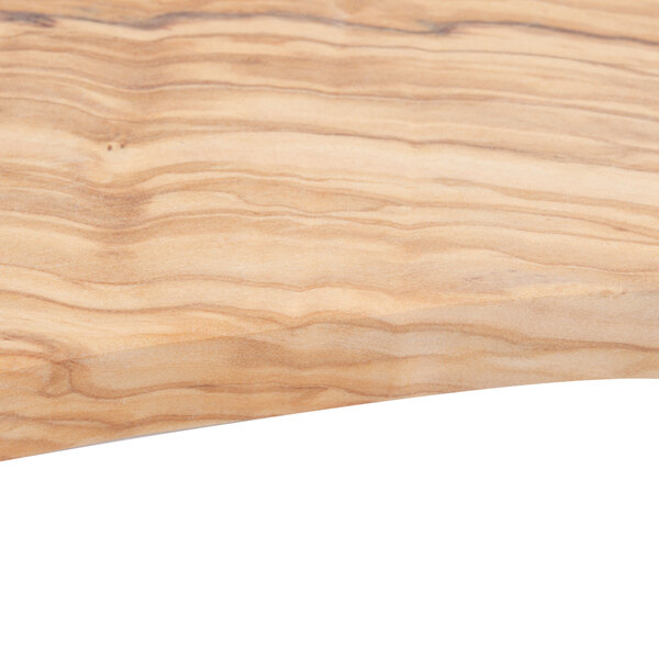 An American Metalcraft olive wood serving board on a wooden surface.