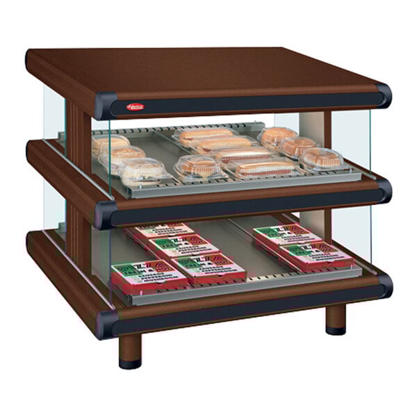 A brown box with a Hatco Antique Copper Slanted Double Shelf Merchandiser with food on the shelves.