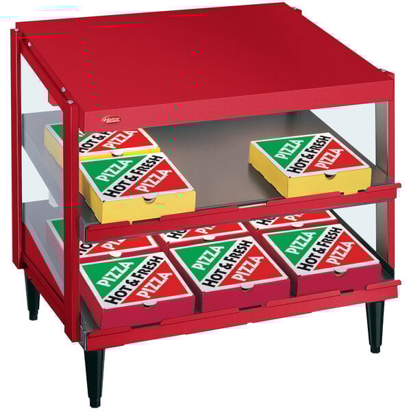 A red Hatco display case with pizza boxes inside.