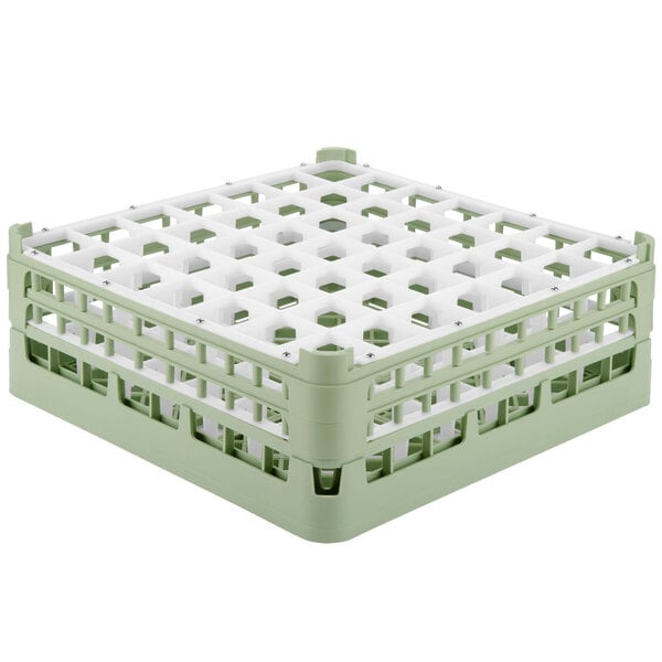A light green plastic Vollrath glass rack with white compartments.