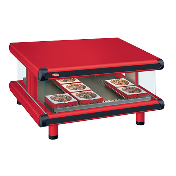 A red Hatco warm food merchandiser with slanted shelves holding food.