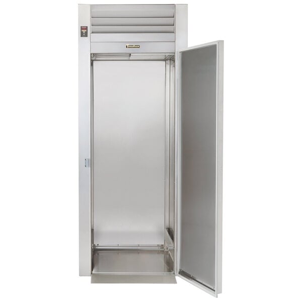 A Traulsen stainless steel roll-in freezer with a stainless steel door and silver handle.