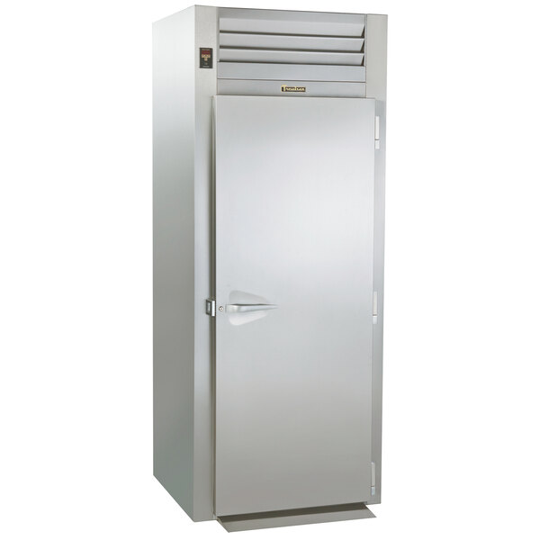 A stainless steel Traulsen roll-in freezer with a solid door.