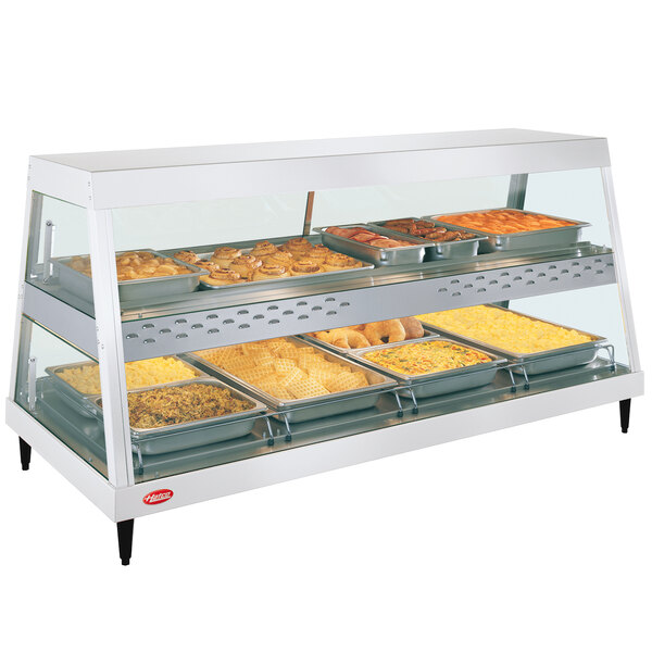 A Hatco countertop display case with food on trays.