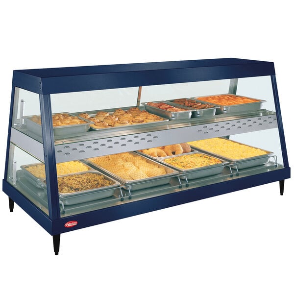 A Hatco countertop food warmer with trays of food displayed.