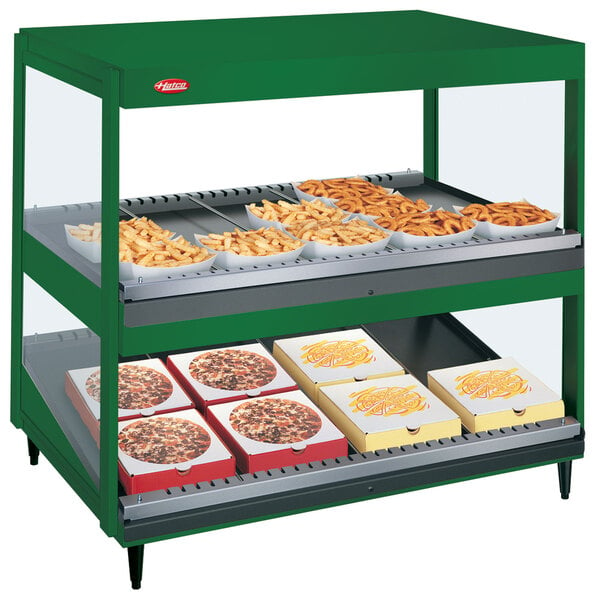 A Hatco Hunter Green countertop display with shelves of food trays.