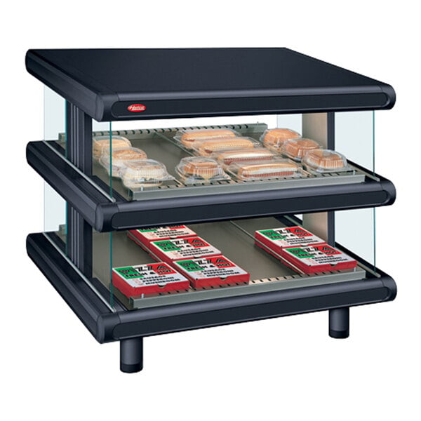 A black Hatco countertop display case with food on shelves.