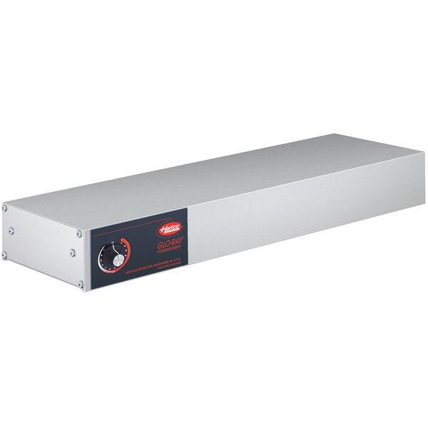 A rectangular stainless steel metal box with white and red buttons and a black label.