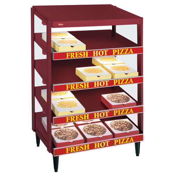 A Hatco Glo-Ray pizza warmer with pizza boxes on the shelves.