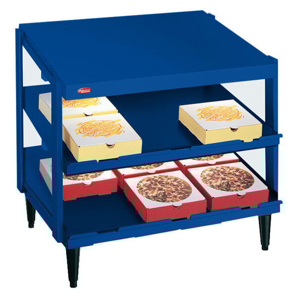 A blue Hatco Glo-Ray double shelf with pizza boxes on it.