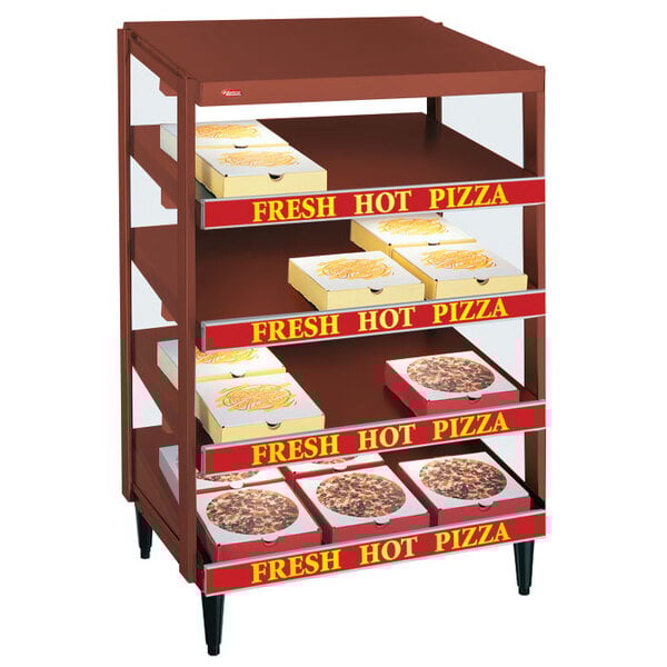 A Hatco Antique Copper pizza warmer with pizza boxes on a shelf.