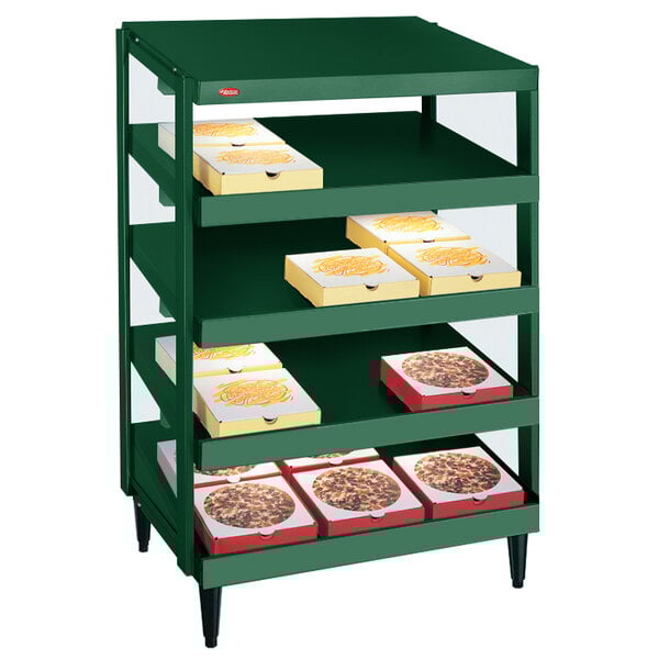 A Hatco Hunter Green Glo-Ray countertop pizza warmer with pizza boxes on the shelves.