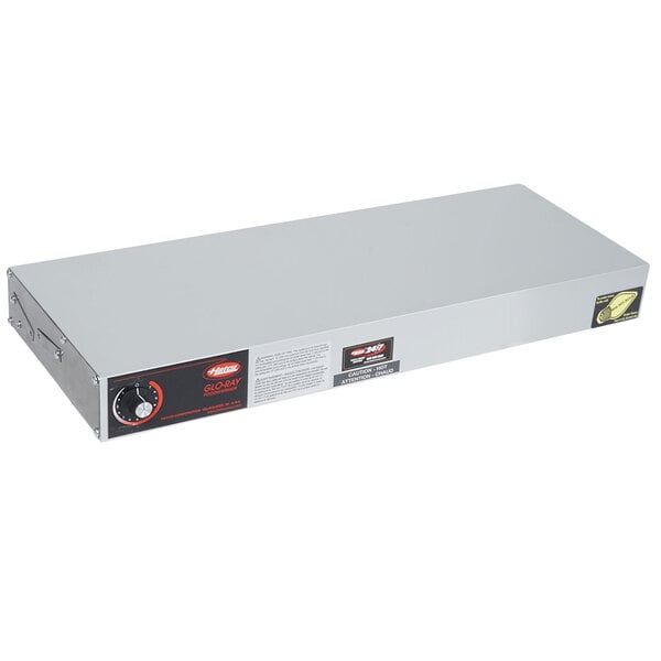 A white rectangular metal box with black text and a knob.