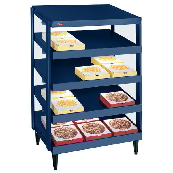 A blue Hatco countertop pizza warmer with pizza boxes on shelves.