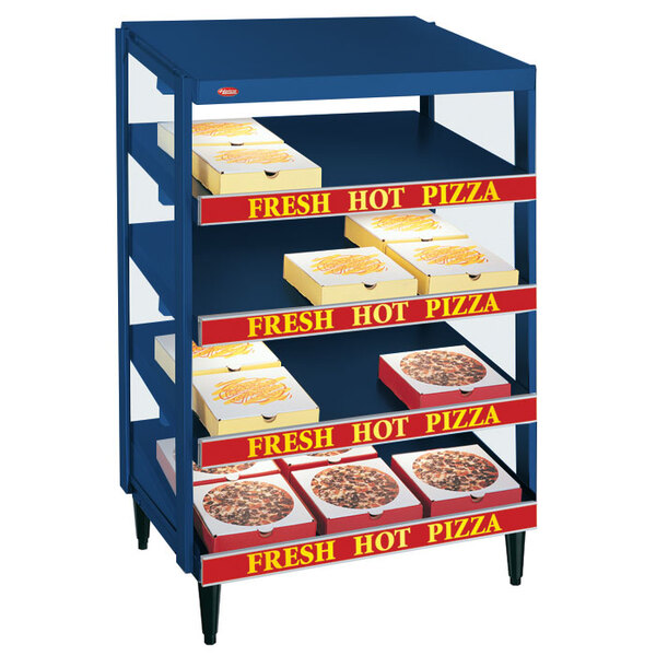 A blue Hatco countertop pizza warmer with pizza boxes inside.
