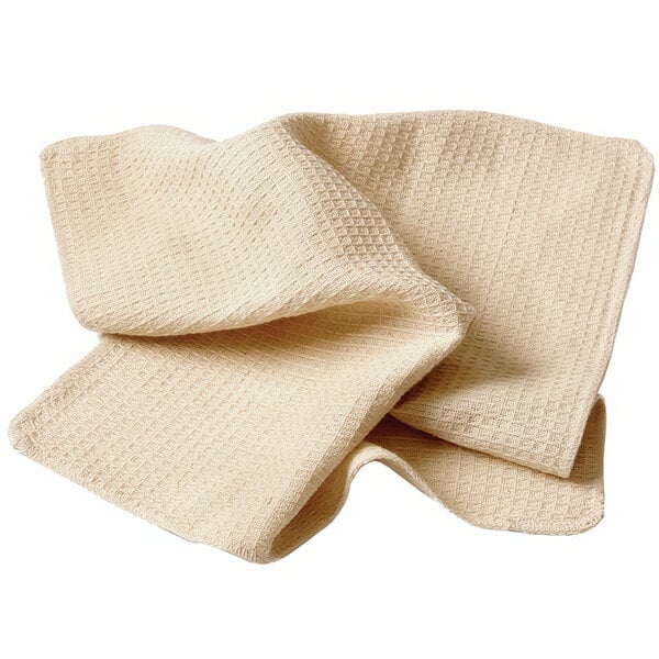 A pair of beige waffle-weave kitchen towels.